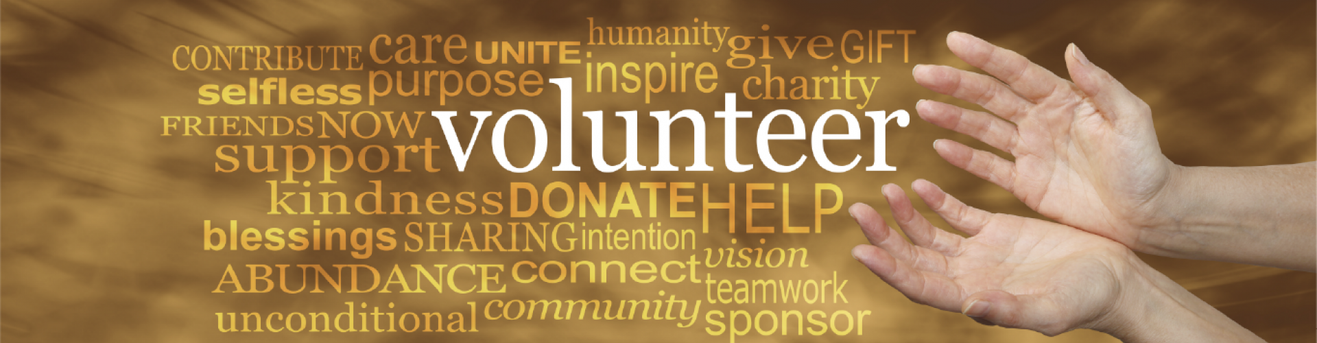 open hands over a background with various words connected to volunteering
