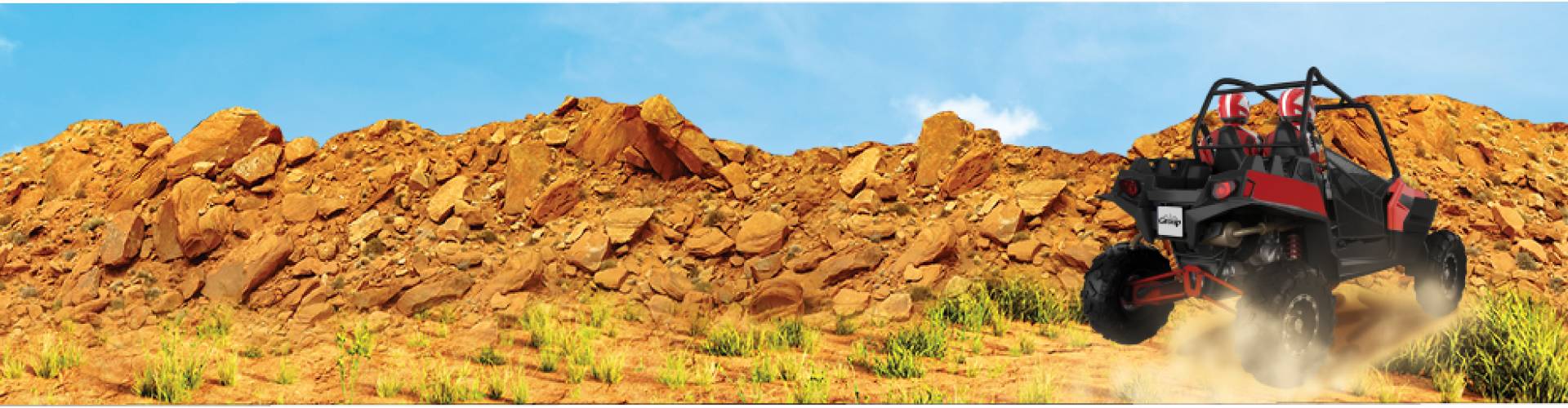 rocky desert hillside with dune buggy