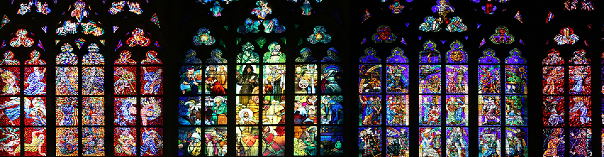 a series of colorful, arched stained glass windows