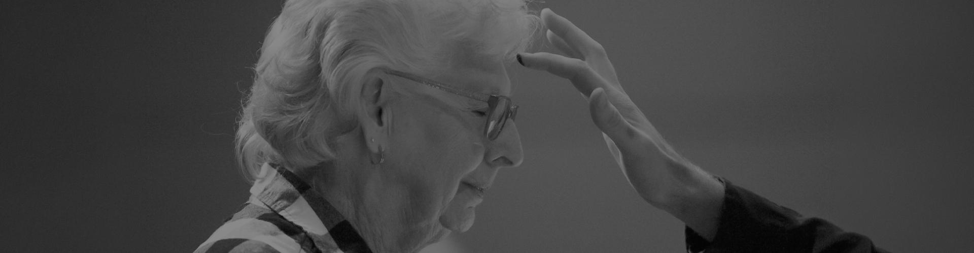 Woman getting ashes on her forehead