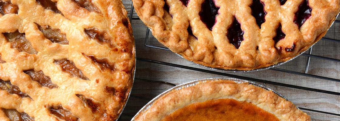 three pies on a wooden table