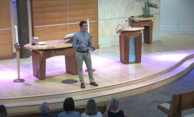Pastor Garrett speaking to congregation