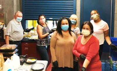 CLC Members serving meal at Bridge to Home shelter