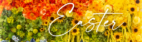 background of bright orange, green, and yellow flowers with the word Easter